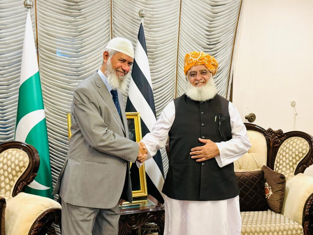 "Dr. Zakir Naik in a thoughtful conversation with Maulana Fazlur Rahman during their meeting